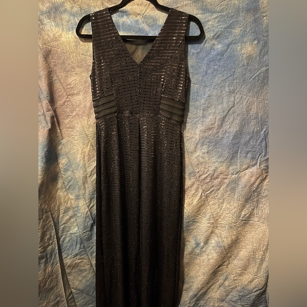 Shiny black evening dress, sheer sides.